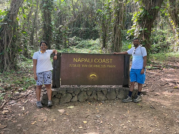 Entrance to the Kalalau trail and a sign board stating Napali Coast Wilderness Park